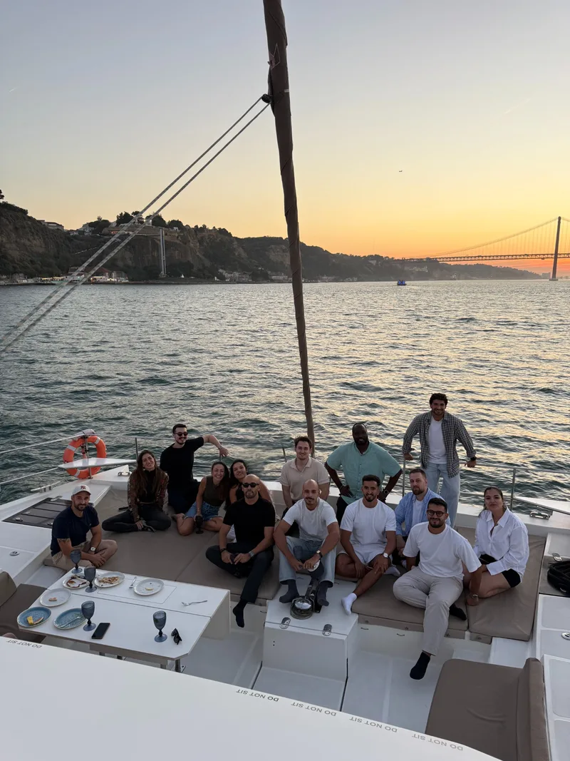 Group gathered on a catamaran on the Tagus during the event organised by OmyCare and Aircall with members of the Zendesk teams, Lisbon, October 2026